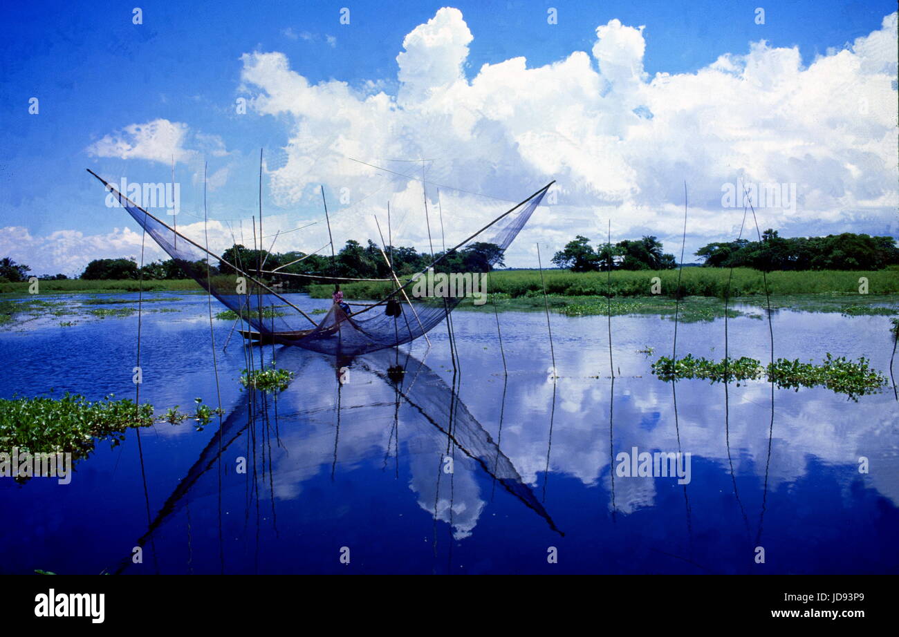 a butterfly shaped fishing net seen in the beautiful autumn fish haor (  biggest lake) surrounding the fascinating reflection of blue sky with cloud  ra Stock Photo - Alamy