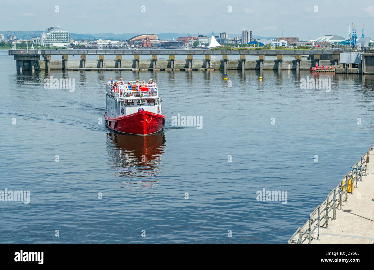 Passenger Ferry coming in to landing stage on Cardiff Bay Lake south