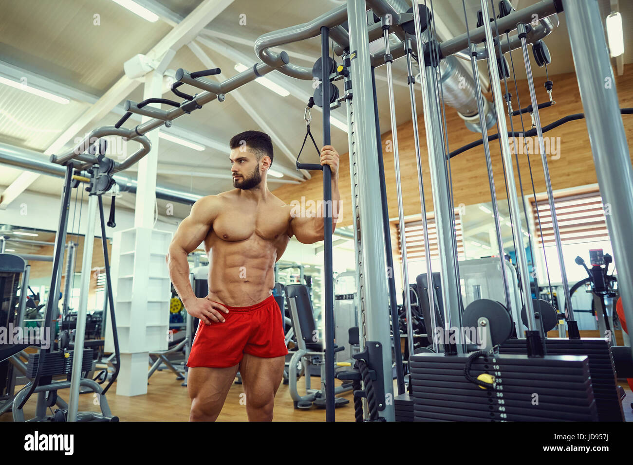 Bodybuilder man posing in the gym Stock Photo