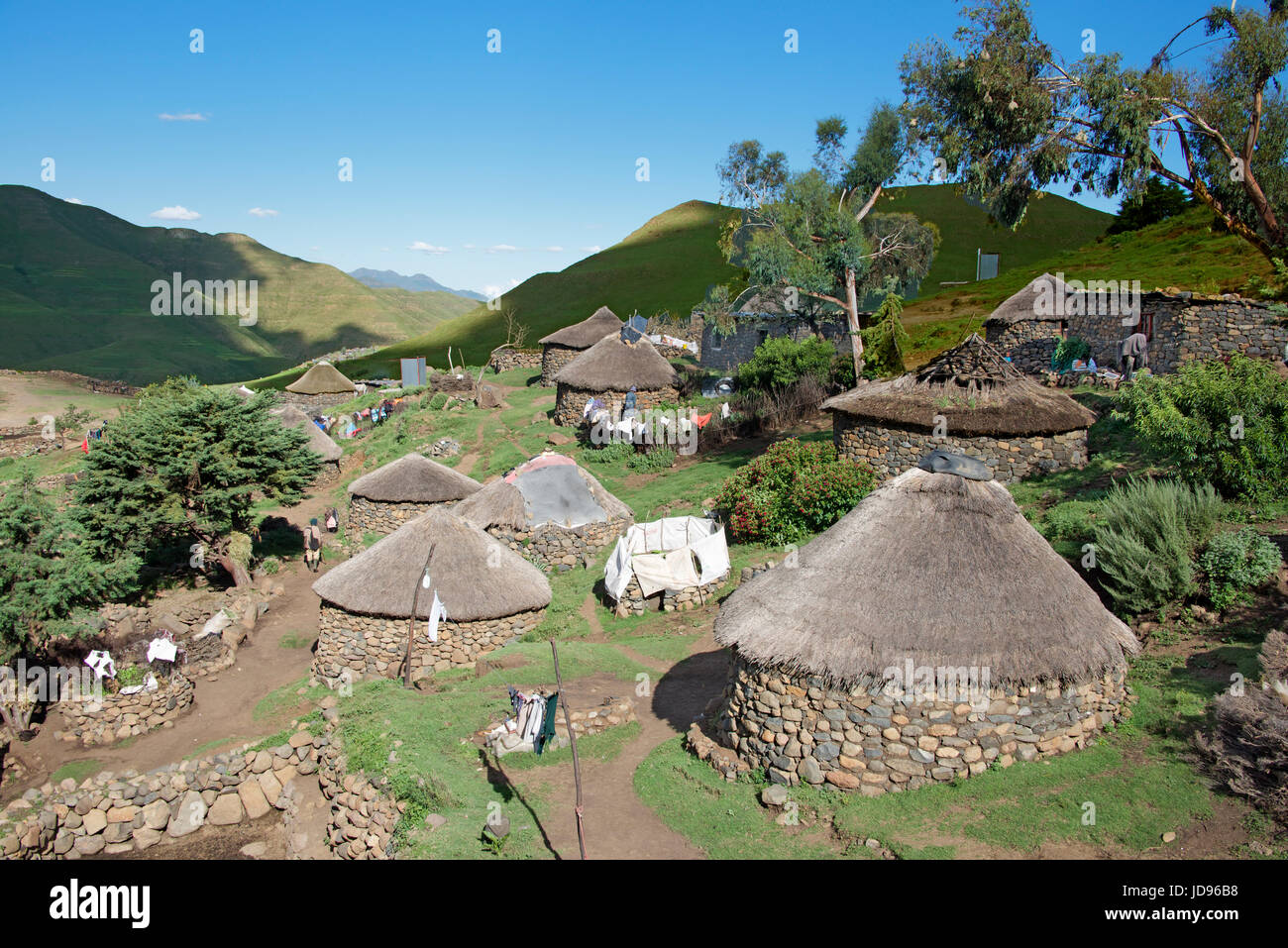 Typical rural village with stone and thatched rondavels Mohales Hoek District Lesotho Southern Africa Stock Photo