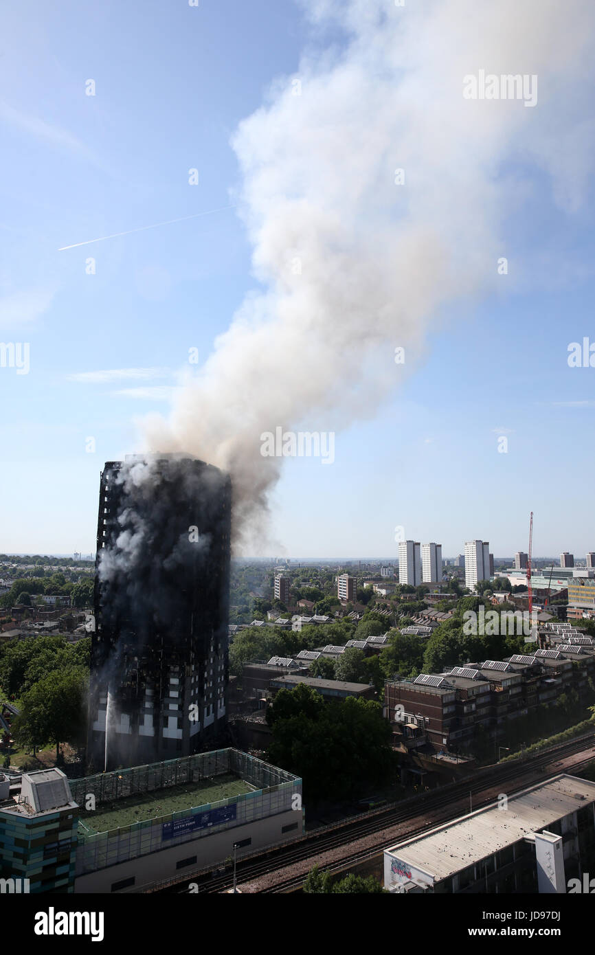 Fire burns at Grenfell Tower in Latimer road, London.The fire stared on the 4th floor when a fridge caught fire. There have been multiple casualties Stock Photo