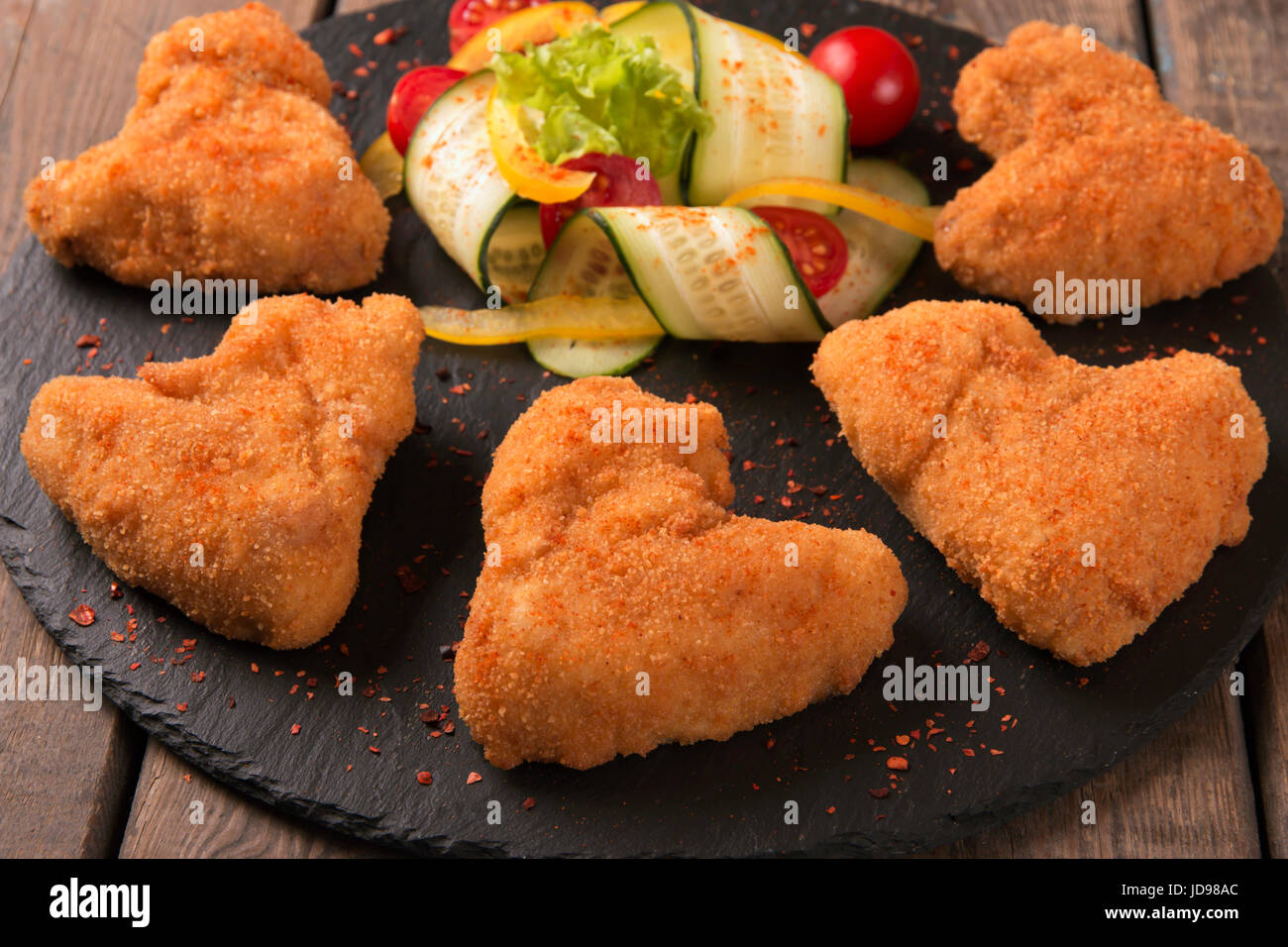 Chicken wings fried in breadcrumbs golden Stock Photo