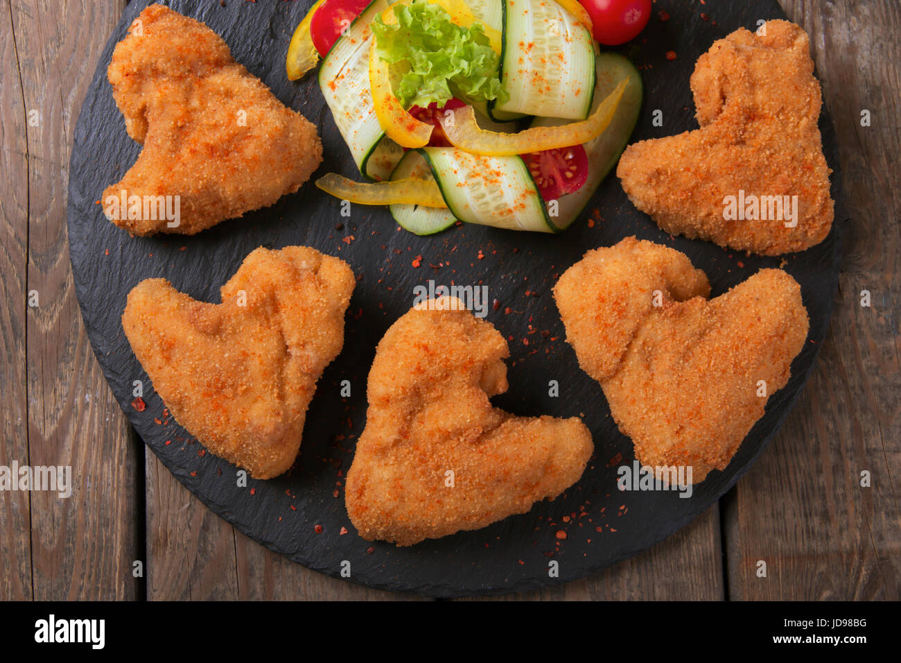 Chicken wings fried in breadcrumbs golden Stock Photo