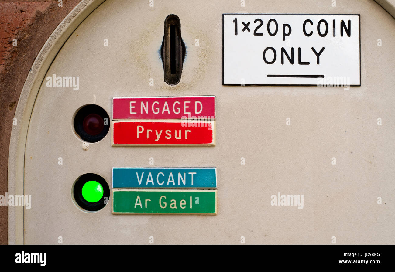 Public convenience payment interface and illuminated indicator. Stock Photo