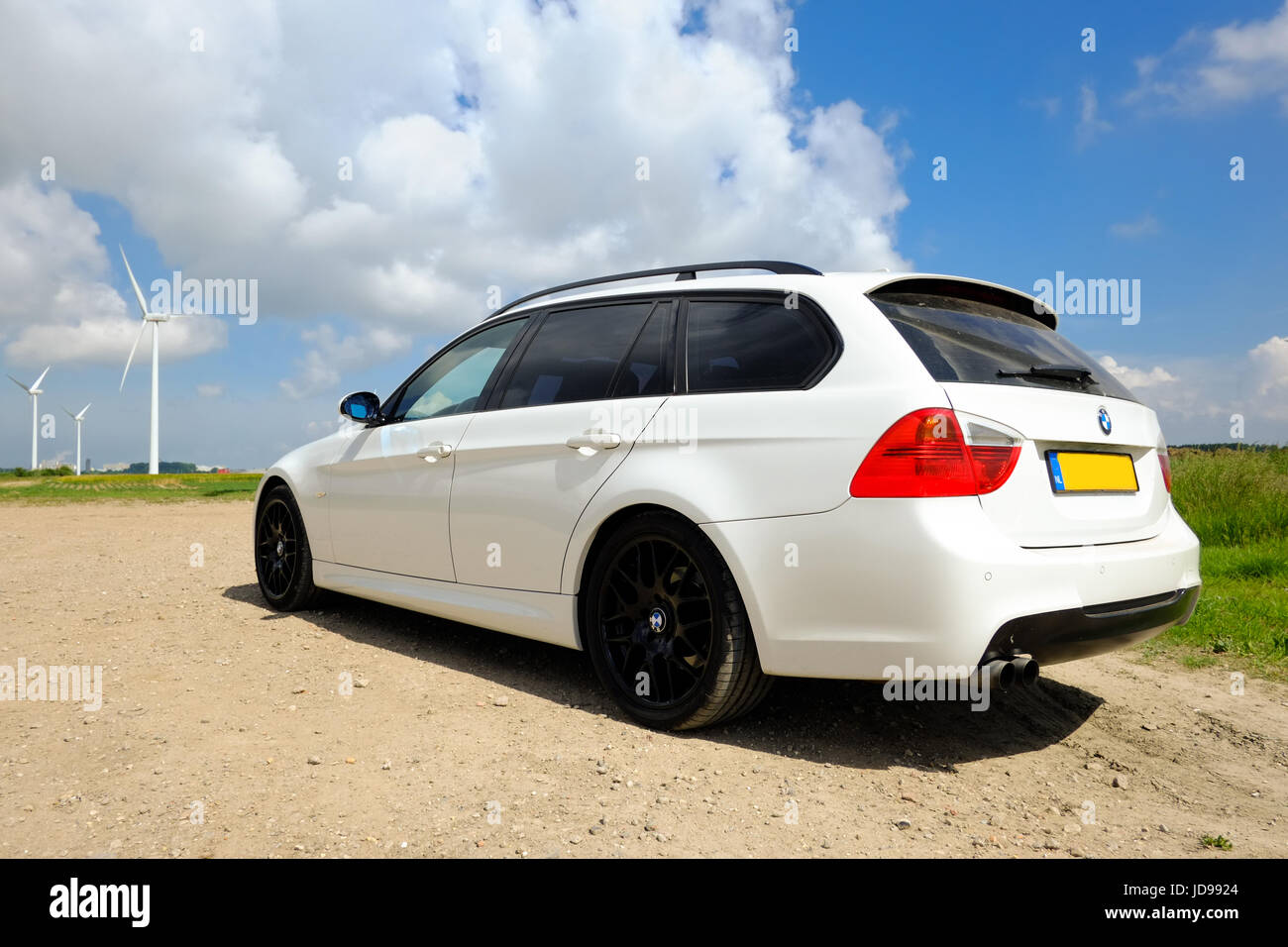 White BMW e91 320i touring with black 18 inch rims Stock Photo - Alamy