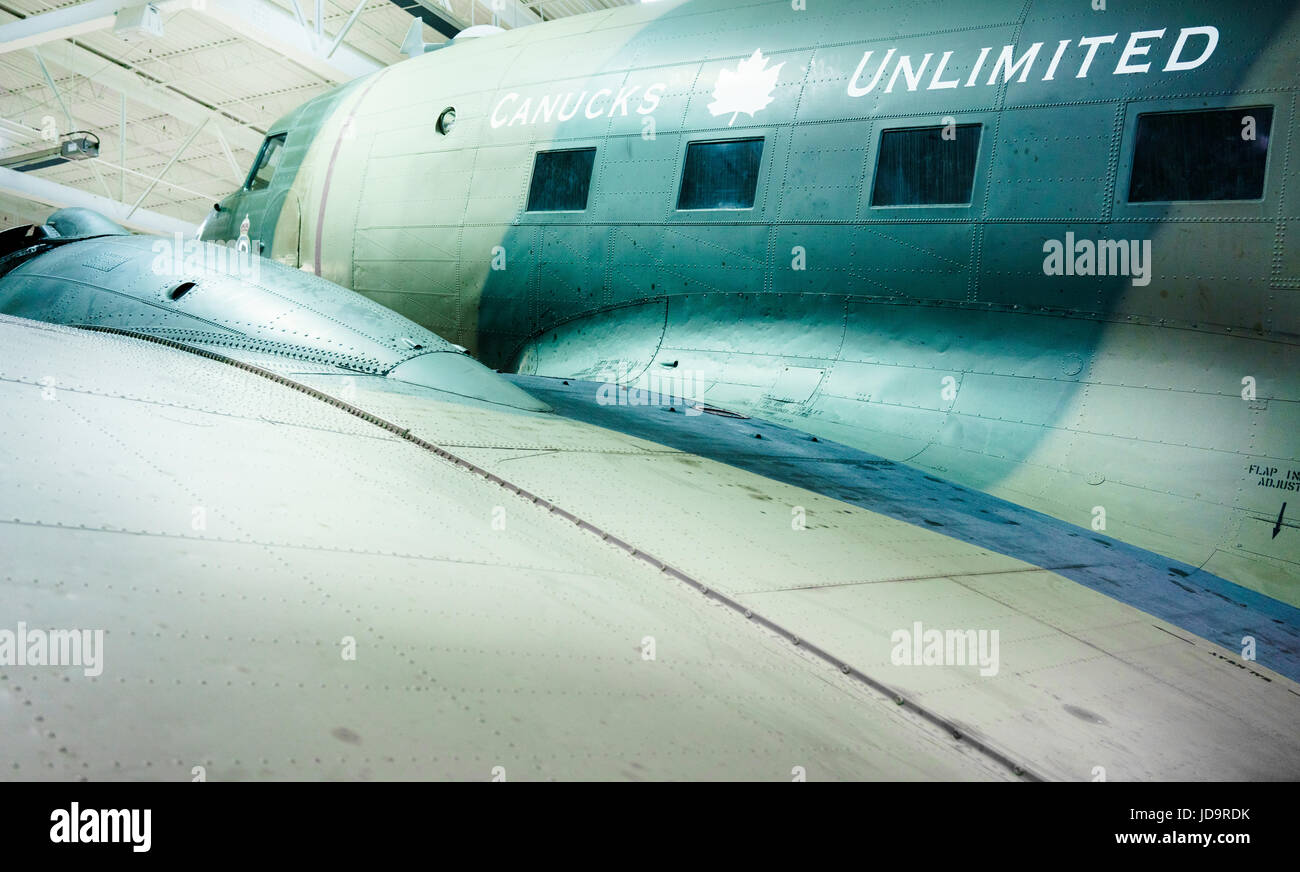 Low angle view from wing of stationary aeroplane, indoors, day. Stock Photo