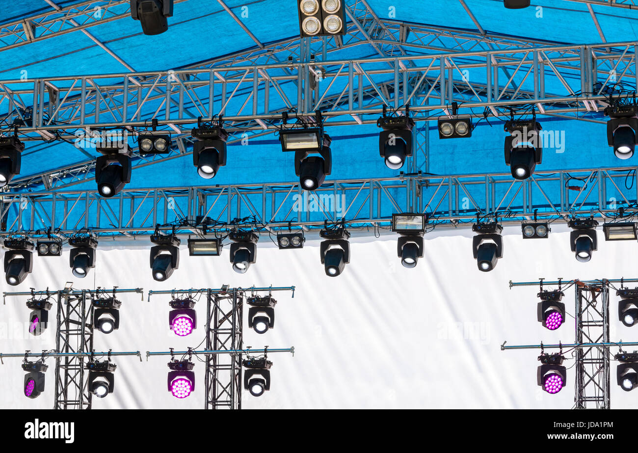 outdoor concert stage with lighting equipment before performance Stock