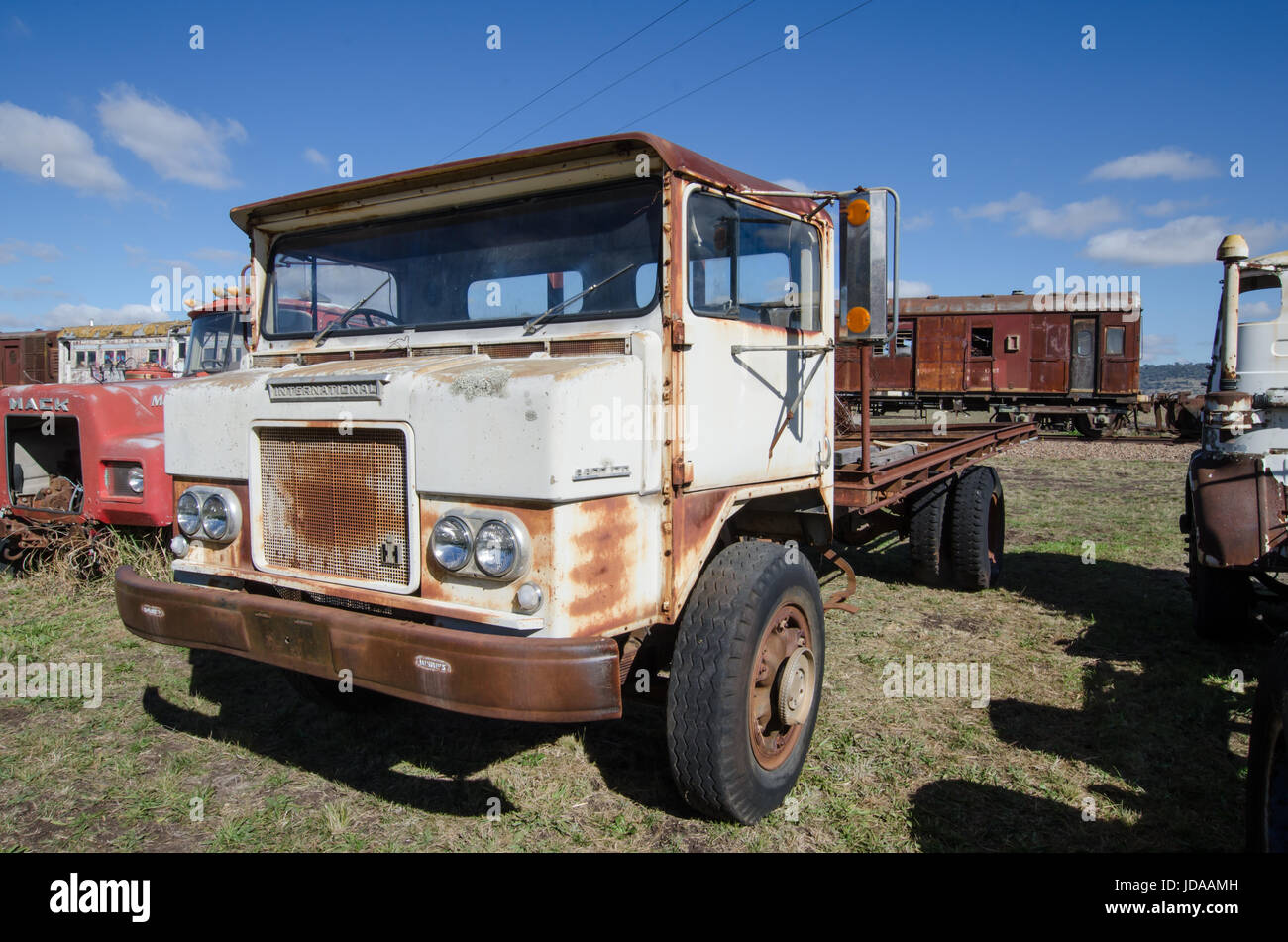 An Old International Harvester AACO 170 Series Truck in a Vehicle Graveyard. Stock Photo
