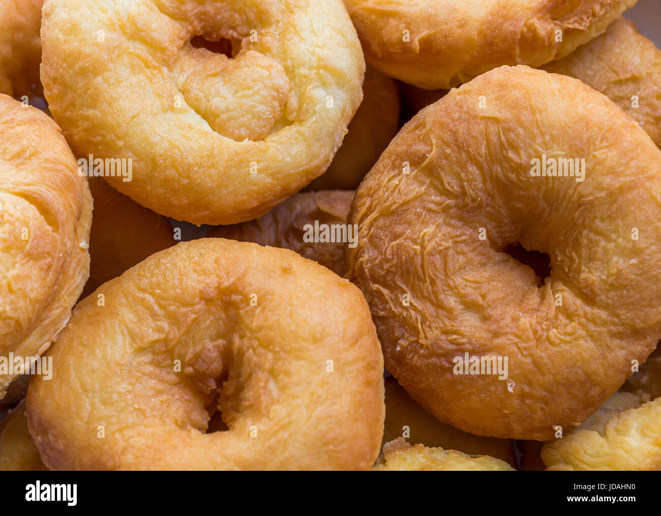 Doughnuts fried in oil lie in the plate closeup Stock Photo Alamy