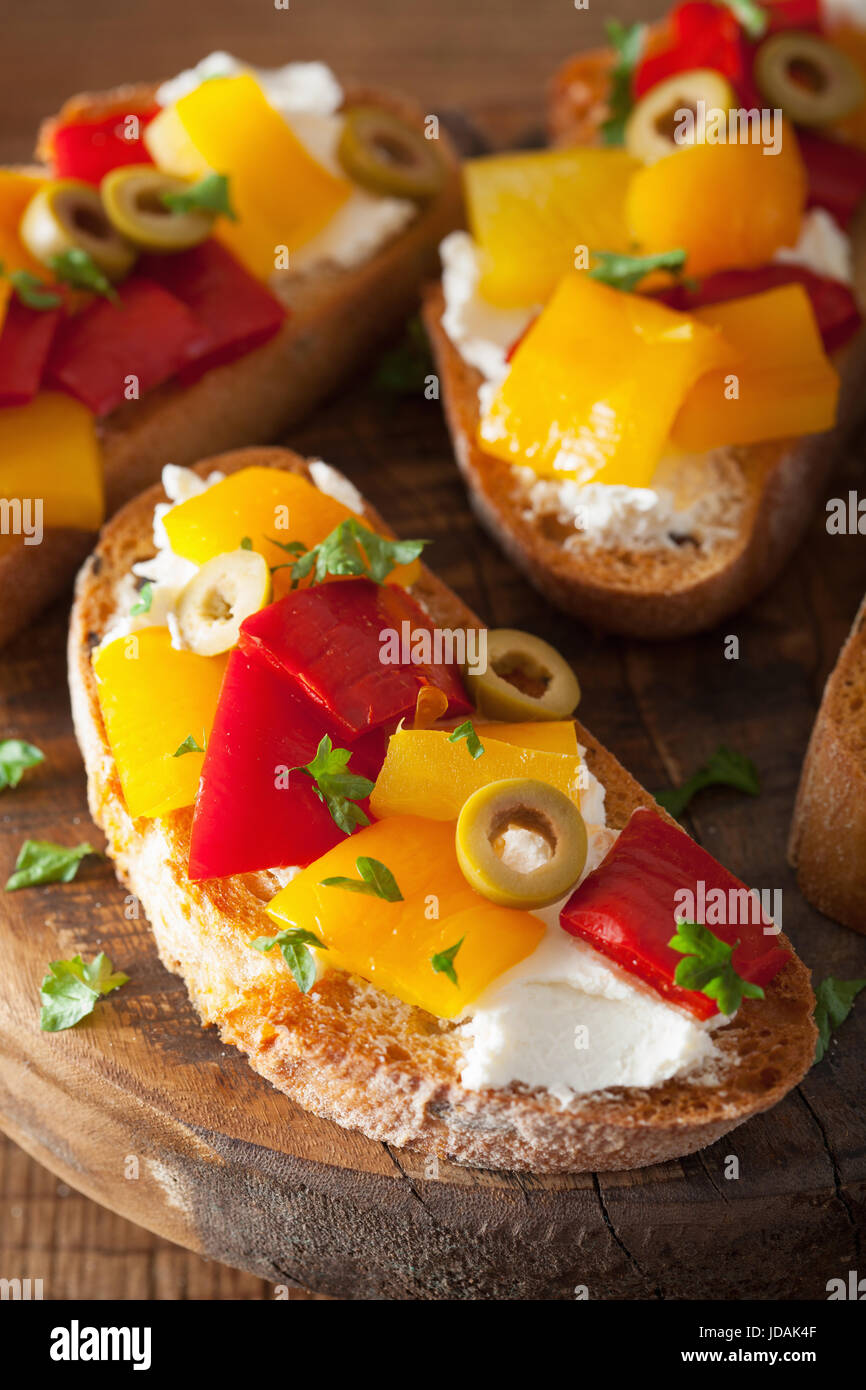 italian bruschetta with roasted peppers goat cheese olives Stock Photo
