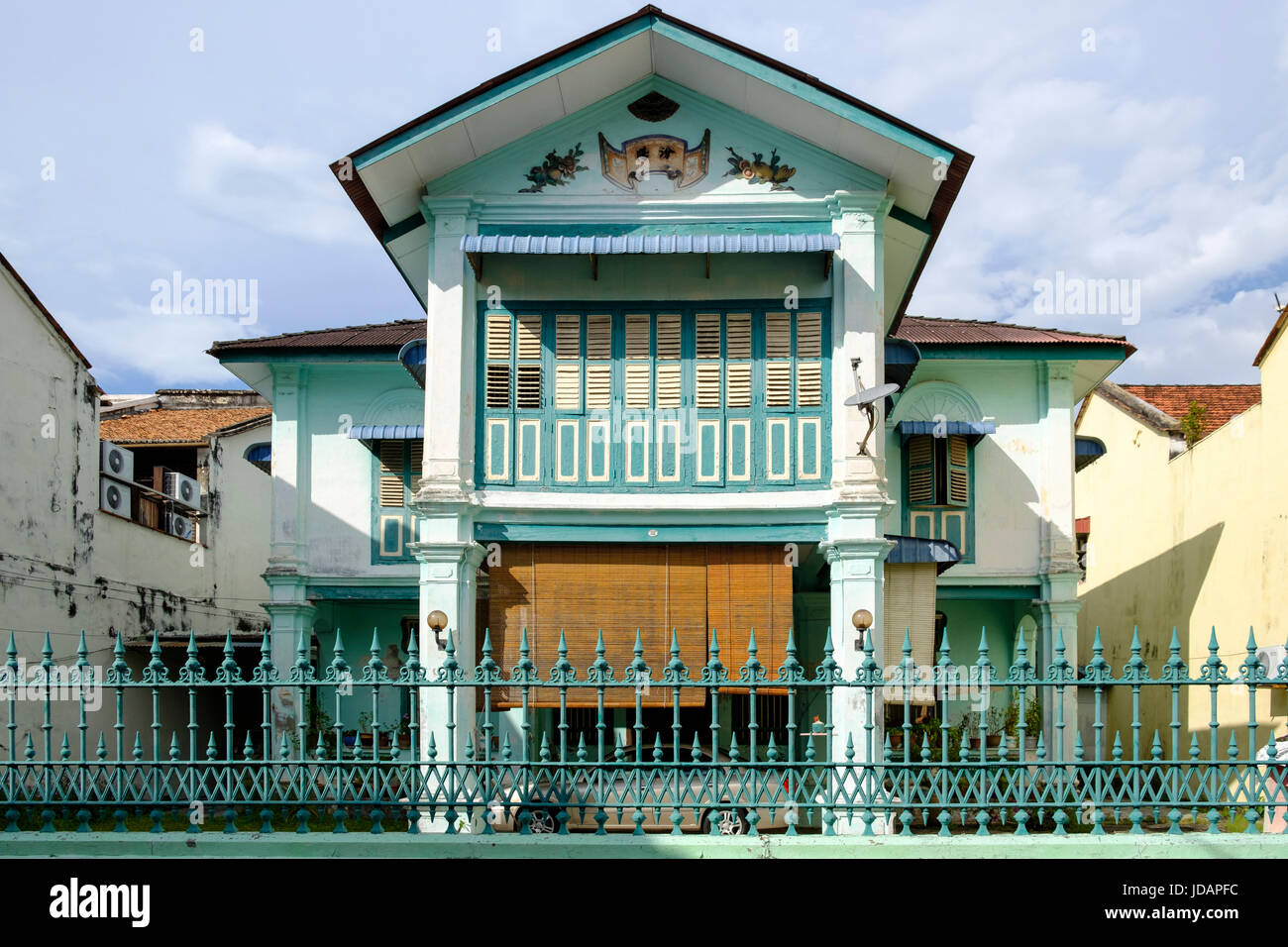 A typical, Peranakan (Straits Chinese) two-storey townhouse in George Town, Pulau Pinang (Penang), Malaysia. Stock Photo