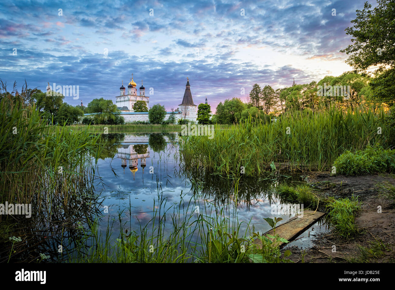 Joseph-Volokolamsk Monastery reflecting in pond on sunset, Moscow oblast, Russia Stock Photo