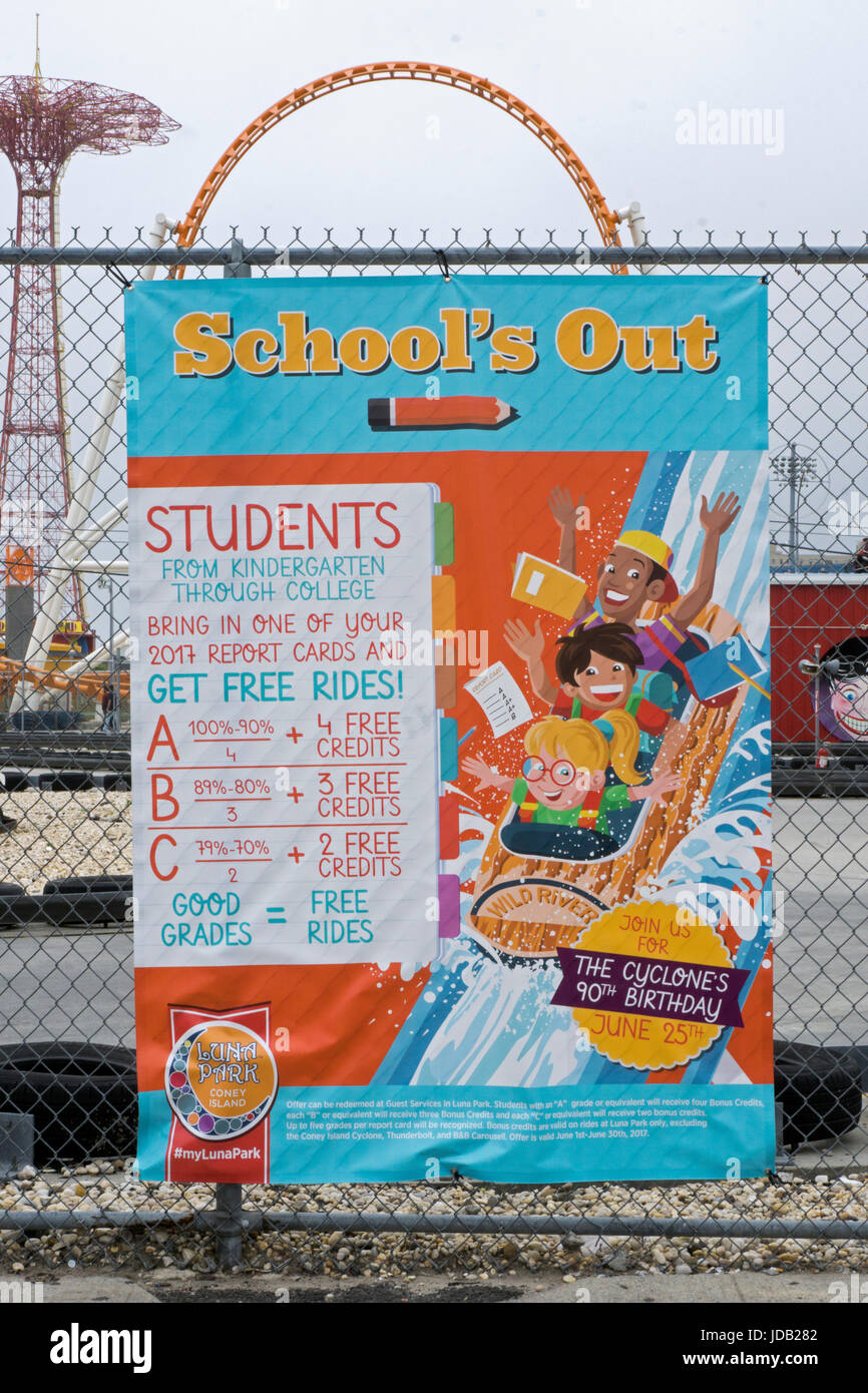 A sign in Coney Island put up by Luna Park amusement Park offering free rides to students with good grades on their report cards. Brooklyn, New York. Stock Photo