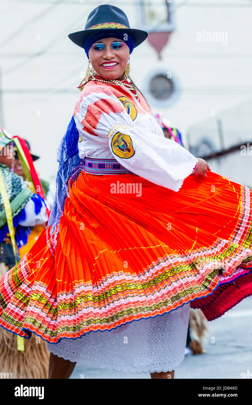 Banos De Agua Santa, Ecuador - 29 November 2014: Indigenous Woman Dancer Is Dancing On The Streets Of Banos De Agua Santa, South America Christmas Hol Stock Photo