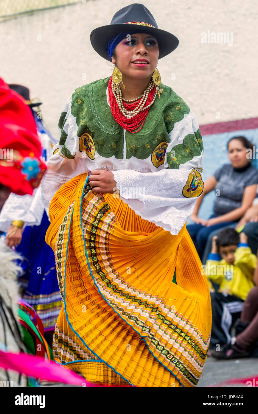 Banos De Agua Santa, Ecuador - 29 November 2014: Indigenous woman dancer is dancing on the streets of Banos de Agua Santa, South America Stock Photo