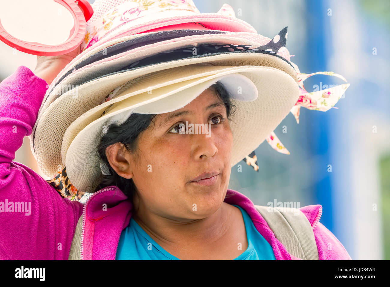 Banos De Agua Santa, Ecuador- 29 November 2014: Portrait Of Hat Seller Woman On The Street Of South America, Christmas Holiday On November 29, 2014 Stock Photo