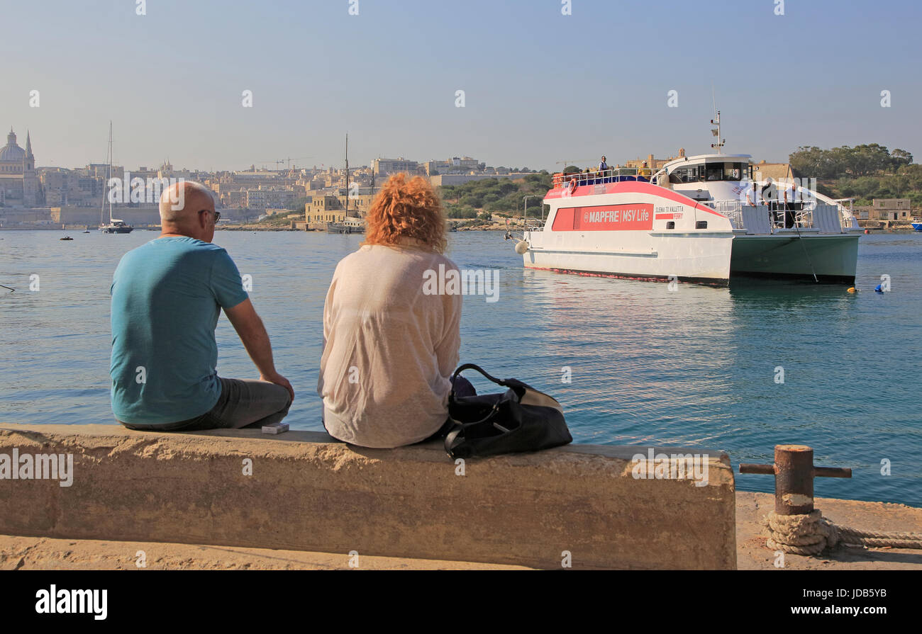 Mapfre catamaran ferry arriving at Sliema from Valletta, Malta Stock Photo