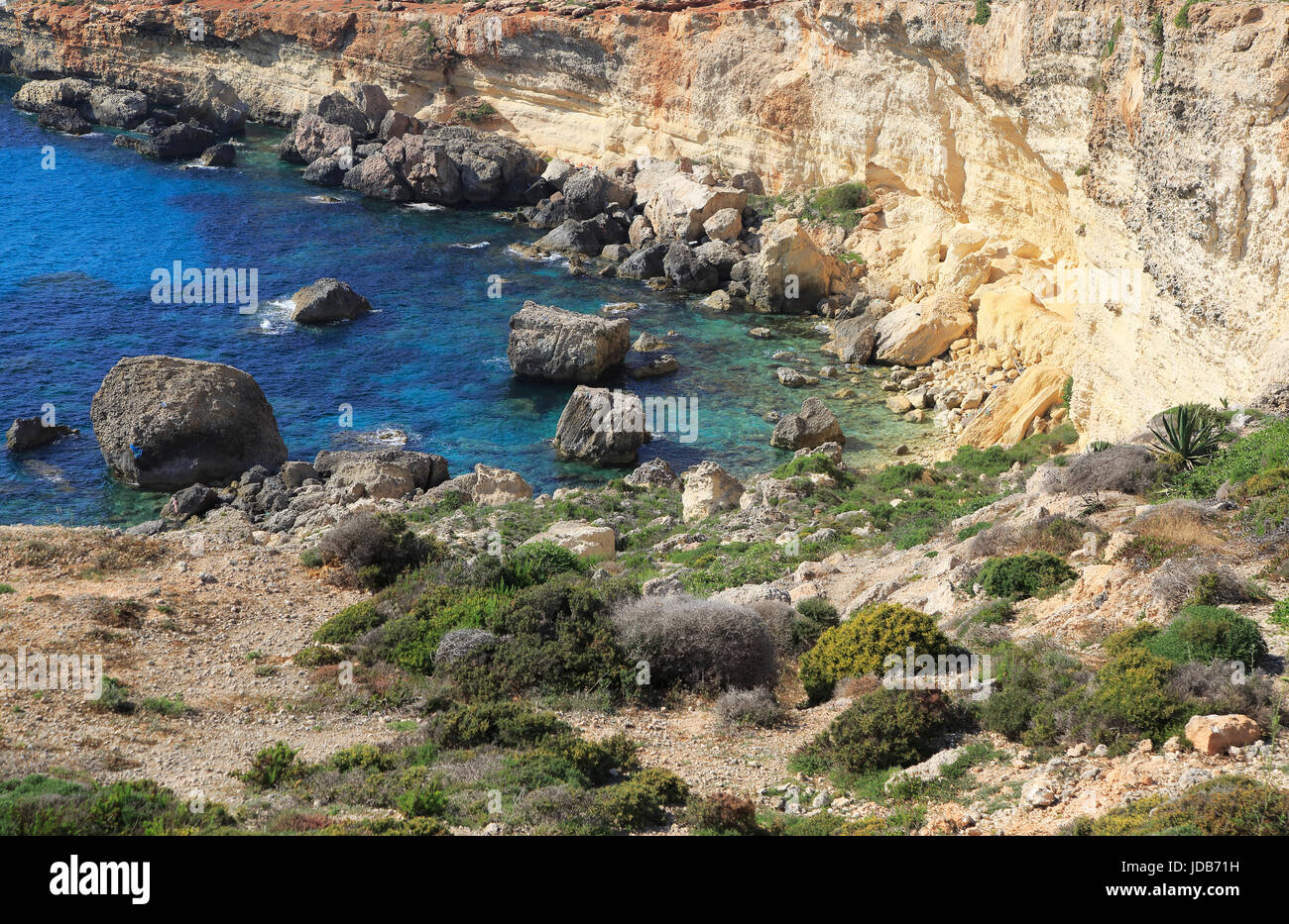 Coastal scenery crumbling cliffs and sea near Cirkewwa, Republic of Malta Stock Photo