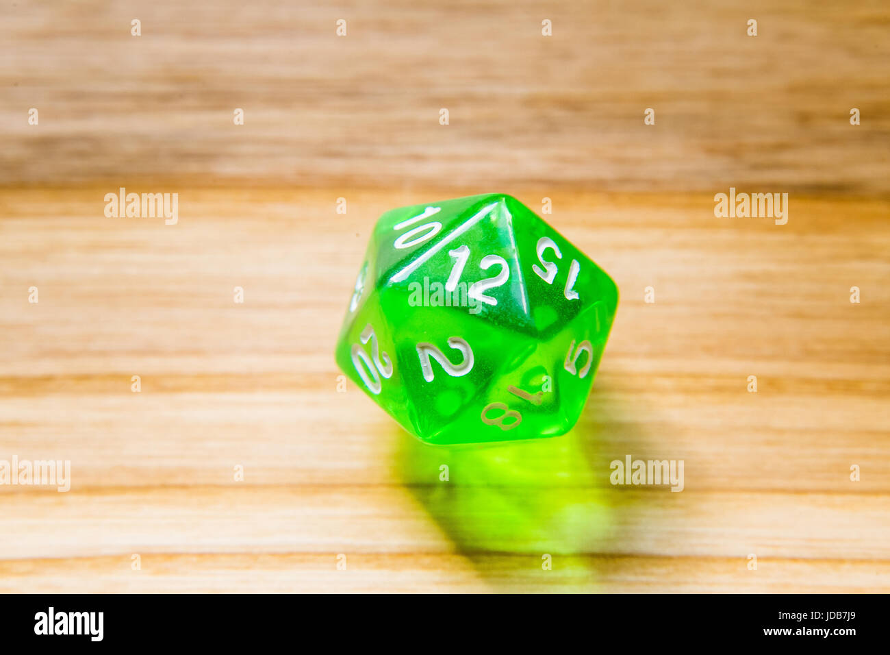 A beautiful winning playing dice rolled on a side on wooden table Stock Photo Alamy