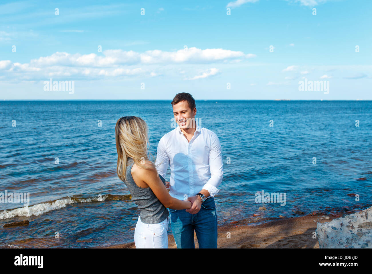 Young couple walking on the beach . Romantic couple in love Stock Photo ...