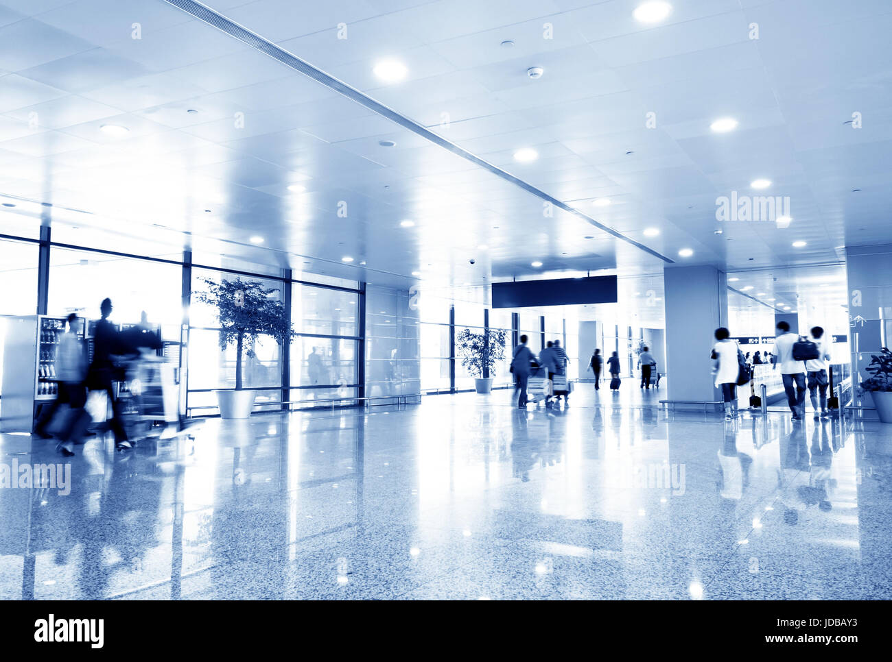 Clean tiled floor, reflection of light on floor and blurred view of