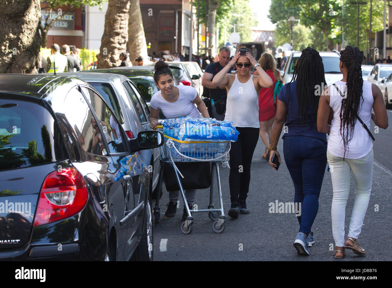 Local community dispensing food and clothes to help aid the victims left homeless after the Grenfell Tower fire disaster, West London, UK Stock Photo