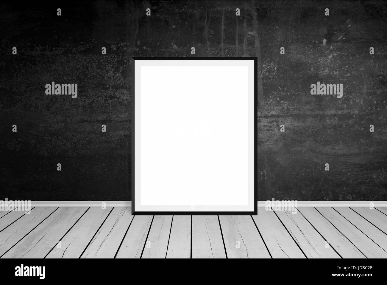 Picture frame leaned on black wall. Empty, white space for mockup art presentation. Wooden floor. Empty room. Stock Photo