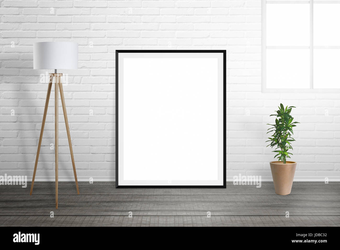 Poster frame mockup. Room interior with lamp and plant. Brick wall and window in background. Stock Photo