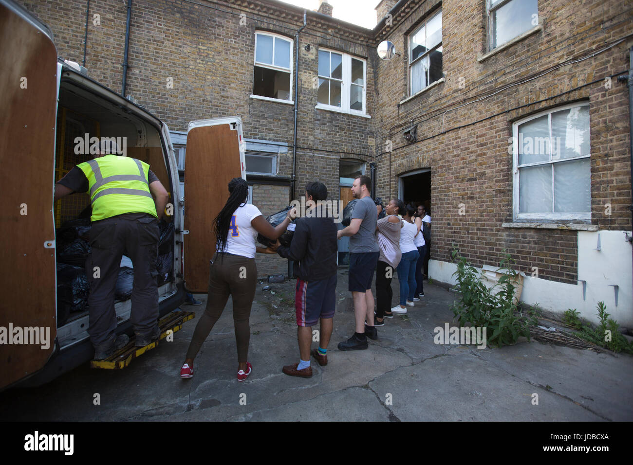Local community dispensing food and clothes to help aid the victims left homeless after the Grenfell Tower fire disaster, West London, UK Stock Photo