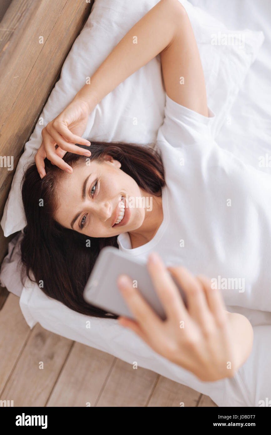 Beautiful girl taking picture of herself in morning Stock Photo