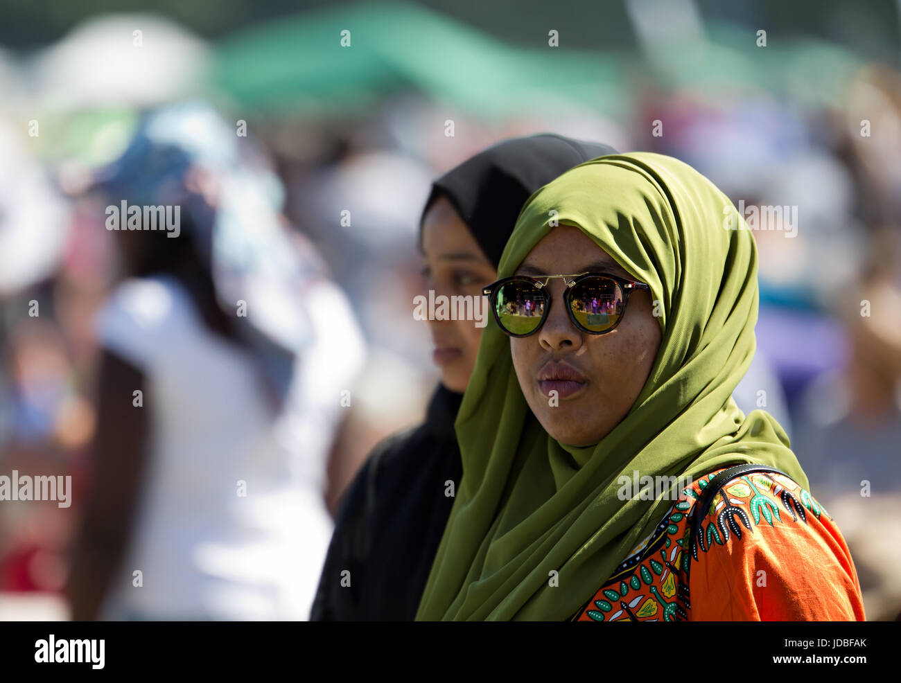 Young muslim women in headscarves enjoying the Africa Oye music festival in Sefton Park Liverpool Stock Photo