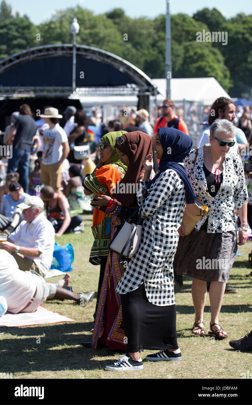 Young muslim women in headscarves enjoying the Africa Oye music festival in Sefton Park Liverpool Stock Photo