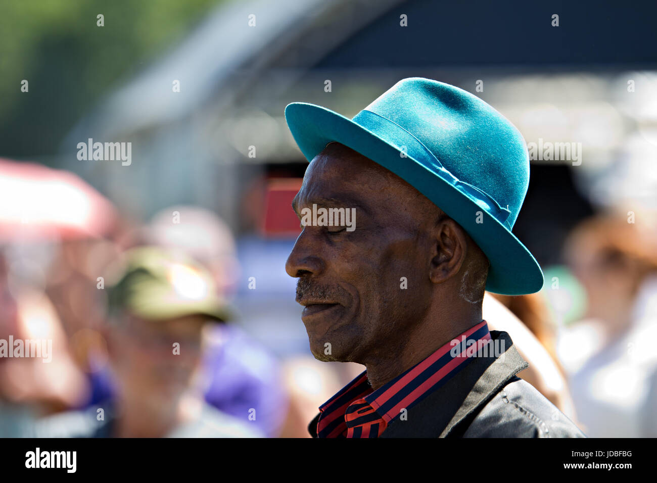 Black man in a trilby hat enjoying the music at the Africa Oye music  festival in Sefton Park Liverpool Stock Photo - Alamy