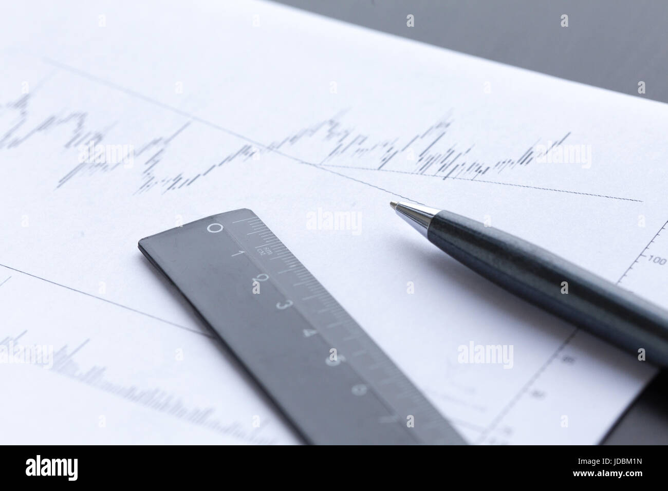 Pen showing diagram on financial report Stock Photo