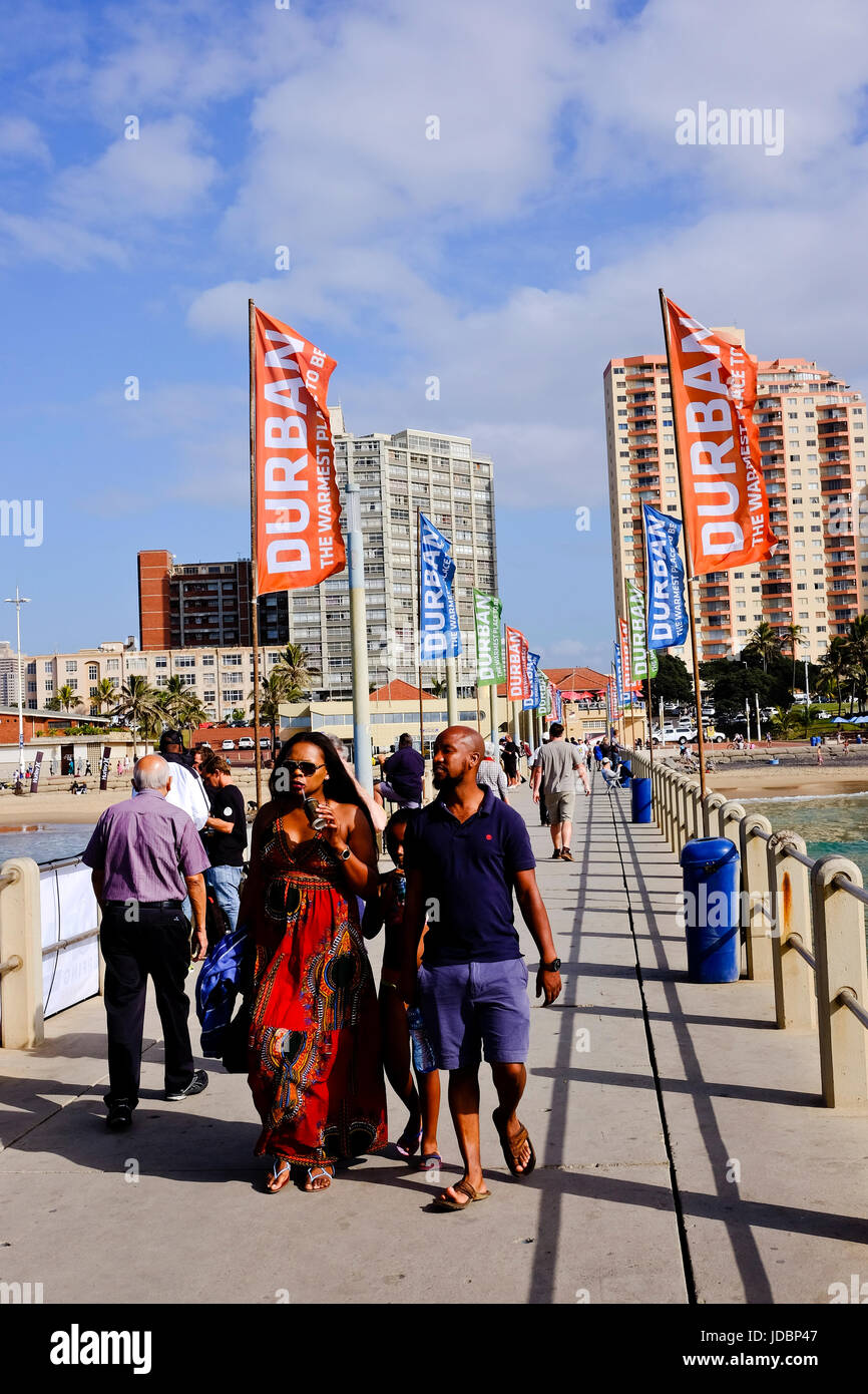 Durban South Africa. Tourist walk along a beachfront pier with the City of Durban in the background. Stock Photo