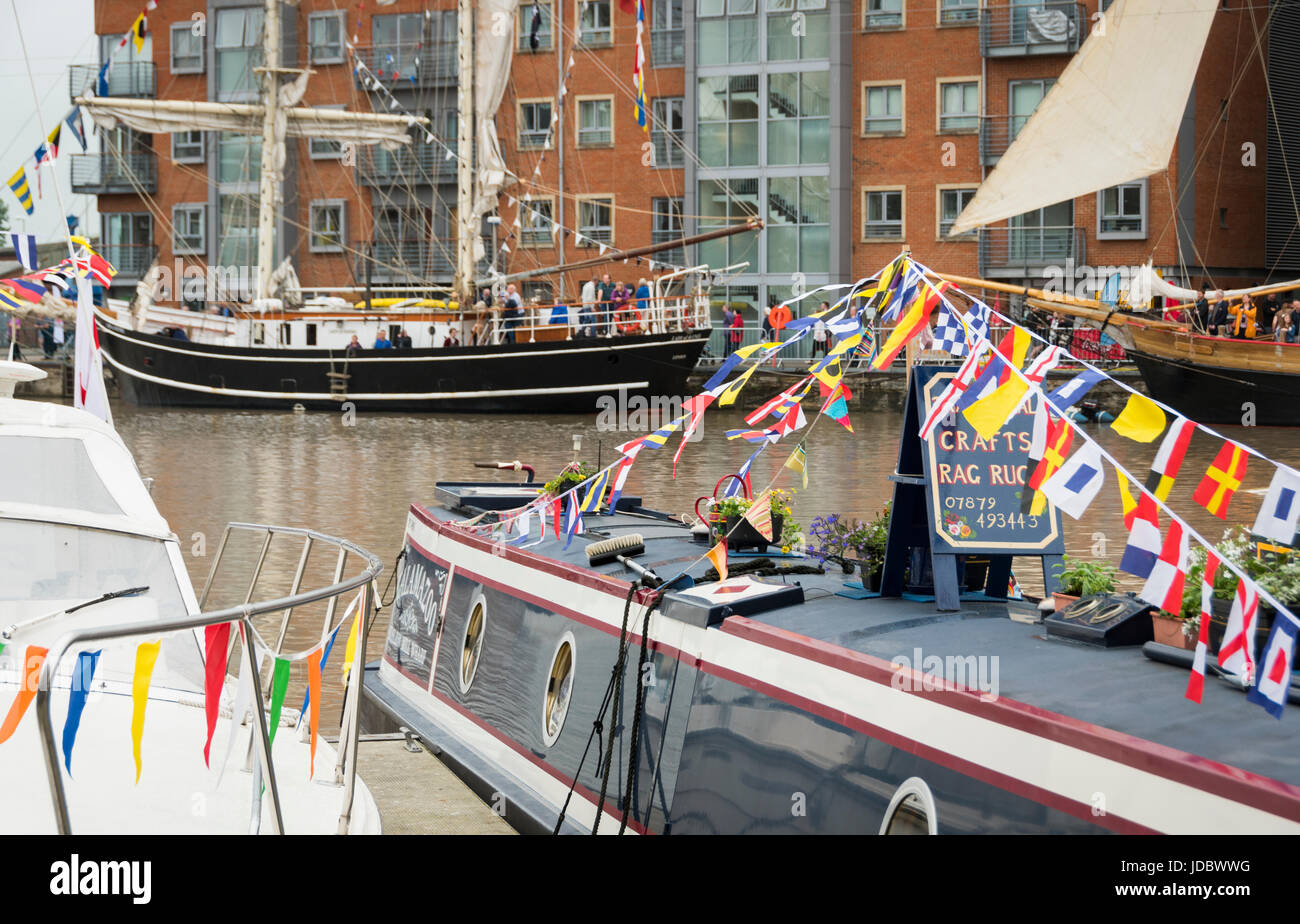 Boats draped in colourful flags and bunting at the Gloucester Tall