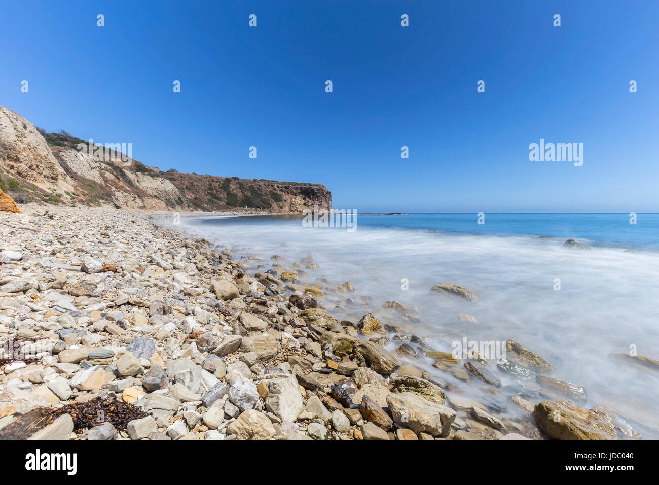 Rocky coast with blurred water motion at Abalone Cove Shoreline Park in Ranch Palos Verdes, California. Stock Photo