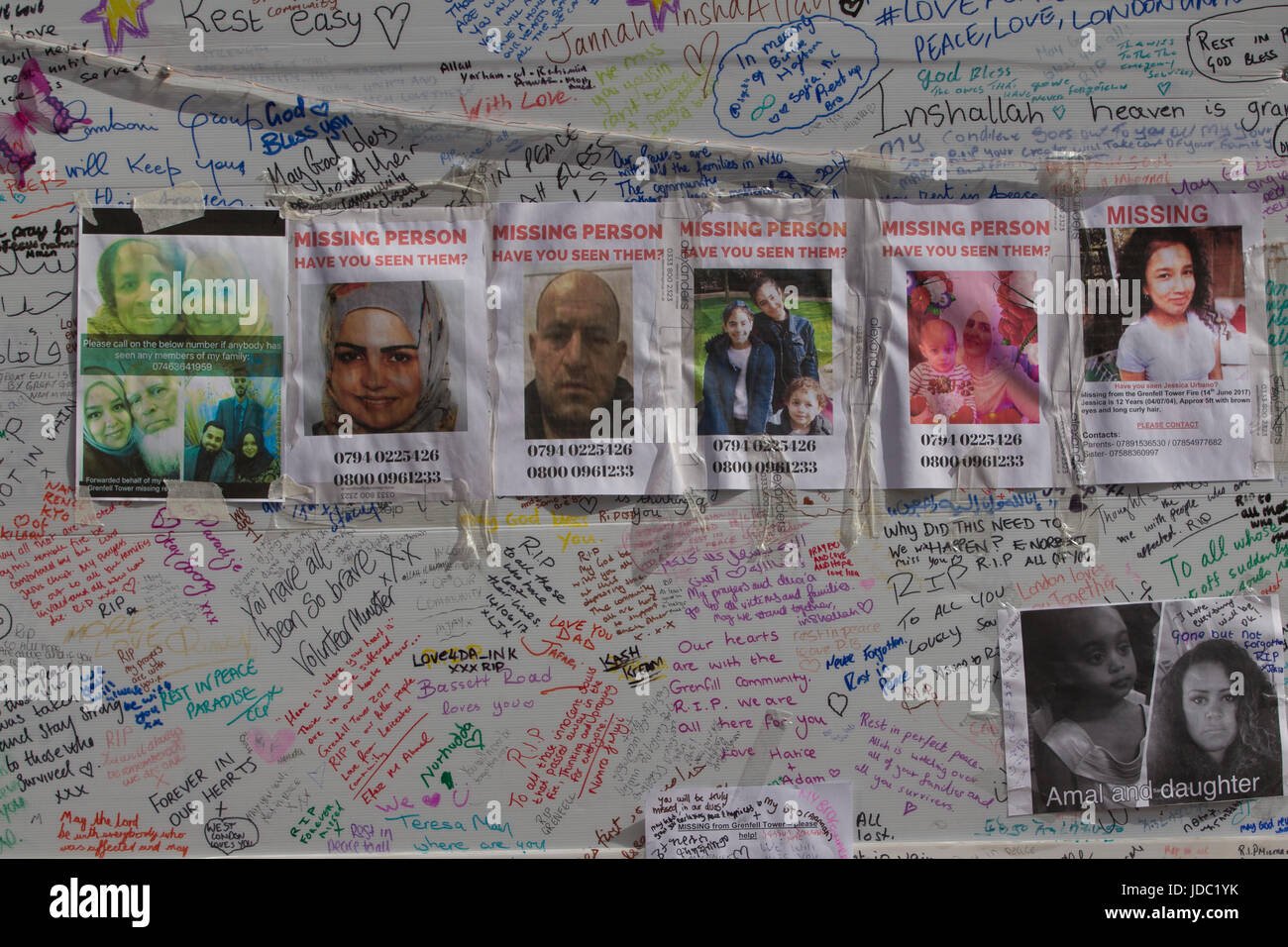 Photographs of the missing victims placed within the local community after the Grenfell Tower fire disaster, West London, UK Stock Photo