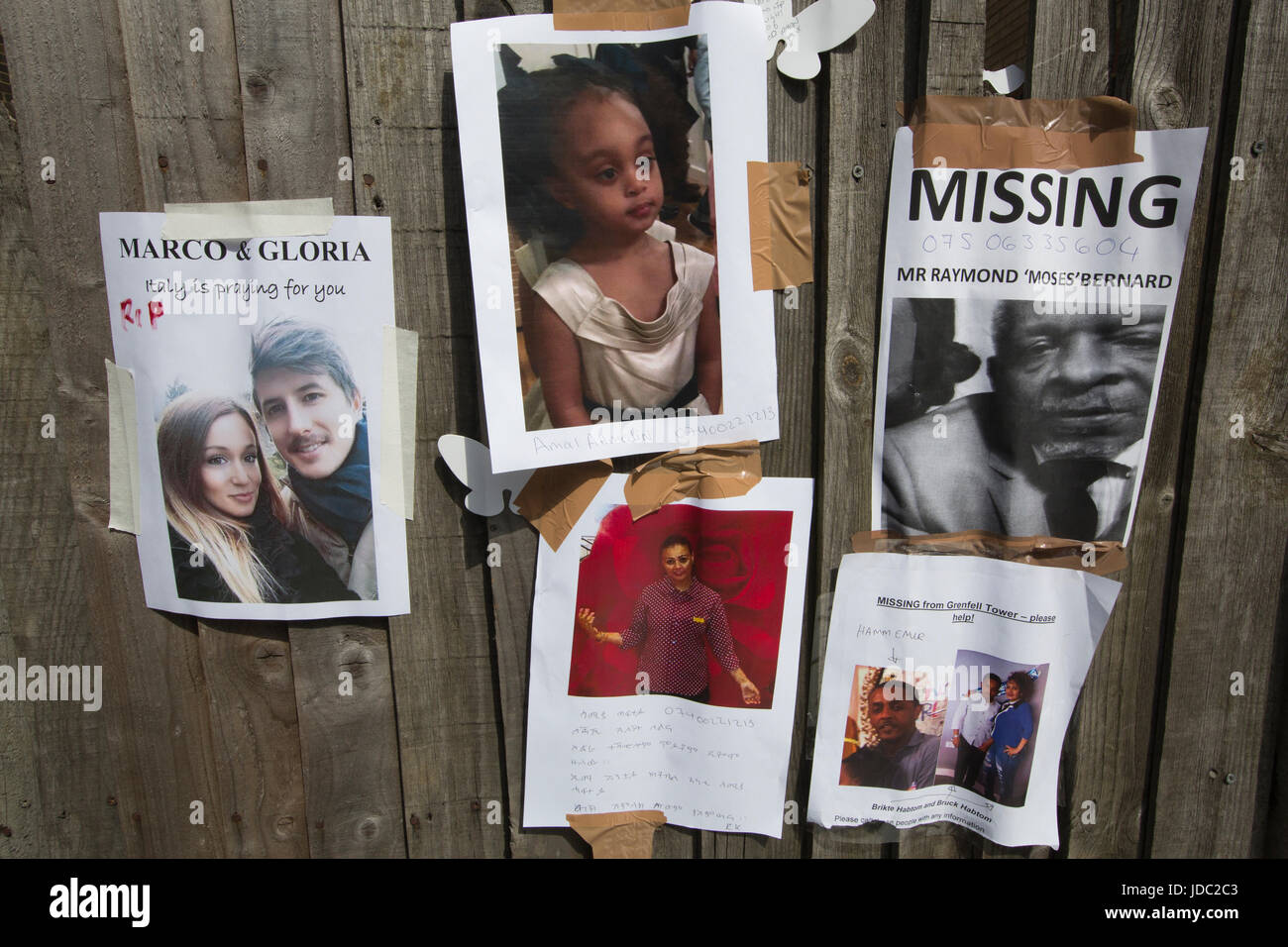 Photographs of the missing victims placed within the local community after the Grenfell Tower fire disaster, West London, UK Stock Photo