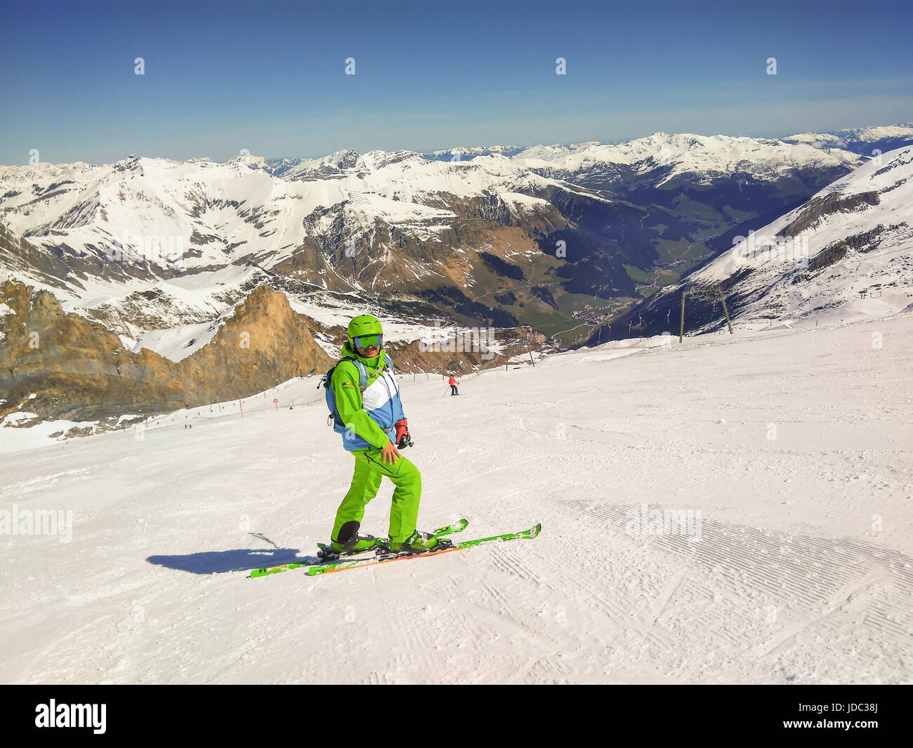 Freeride Skier With Rucksack Running Downhill In Freeze Motion On The Slope In Hintertux, Austria Stock Photo