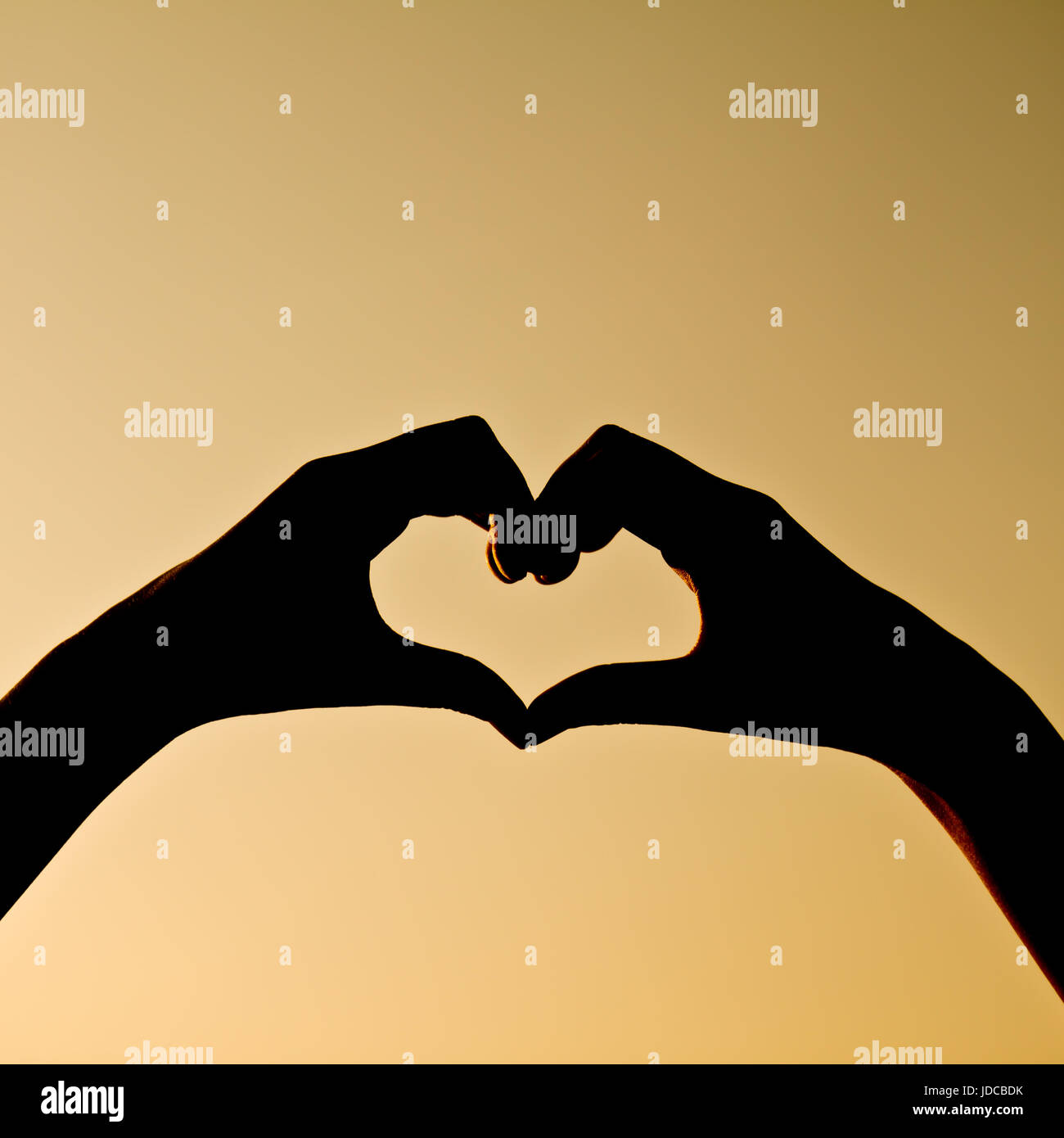 silhouette hand in heart shape Stock Photo - Alamy