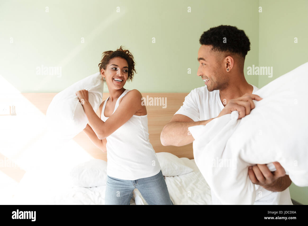 Image of young happy african loving couple have fun indoors at home and ...