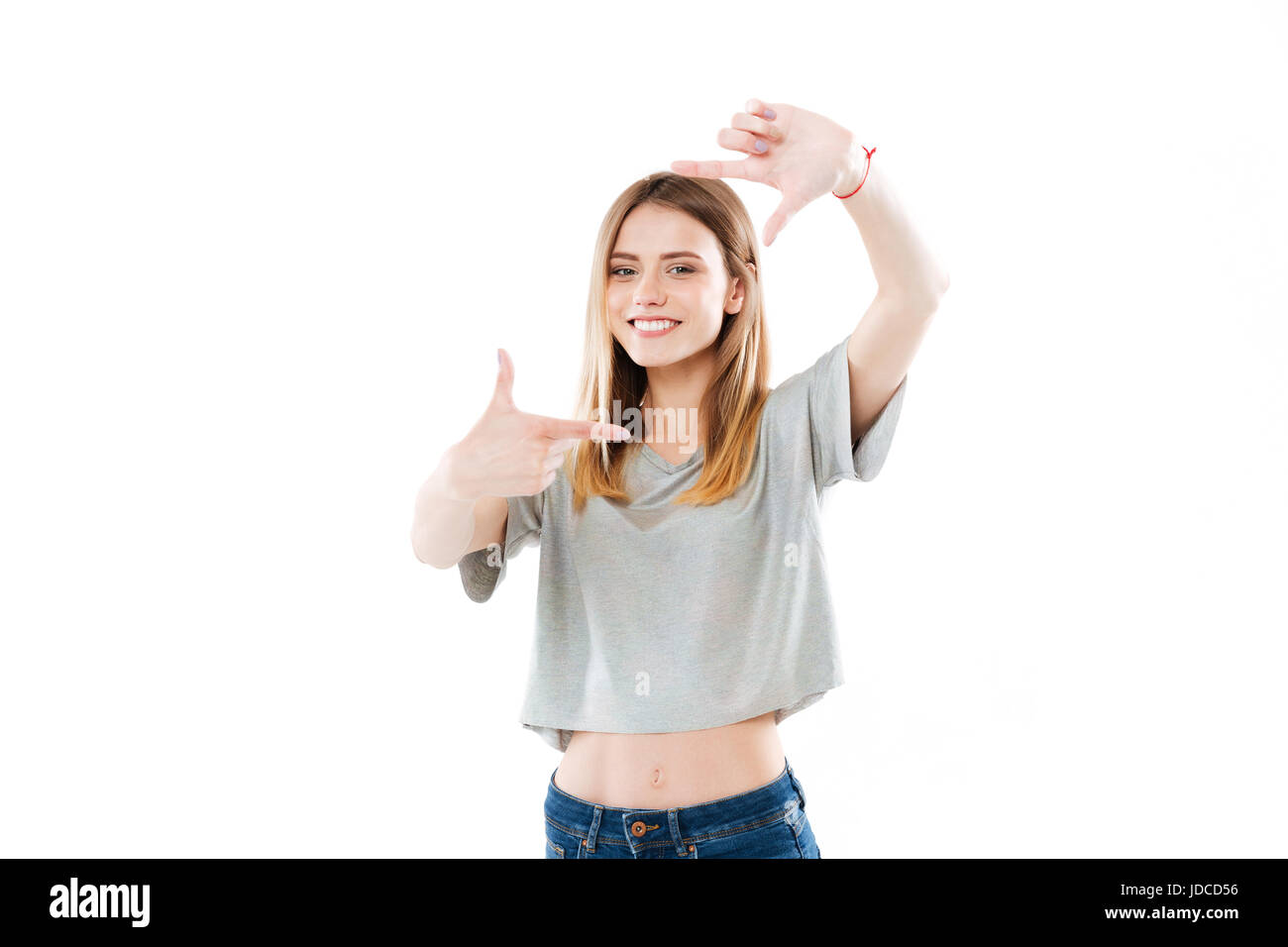 Portrait of a happy smiling woman framing her face with her hands ...
