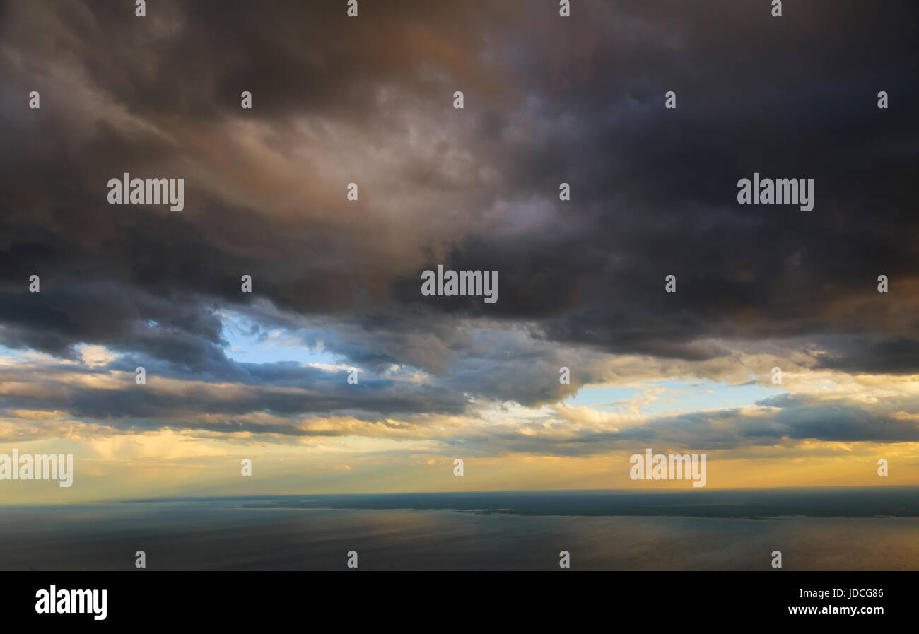 White passenger plane flying in the colorful sunset sky Stock Photo - Alamy