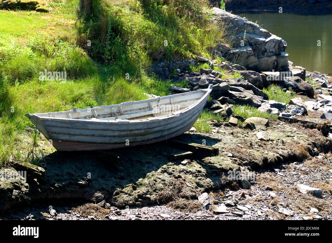 A dory on the shores of a cove in Kittery Point, Maine,USA Stock Photo