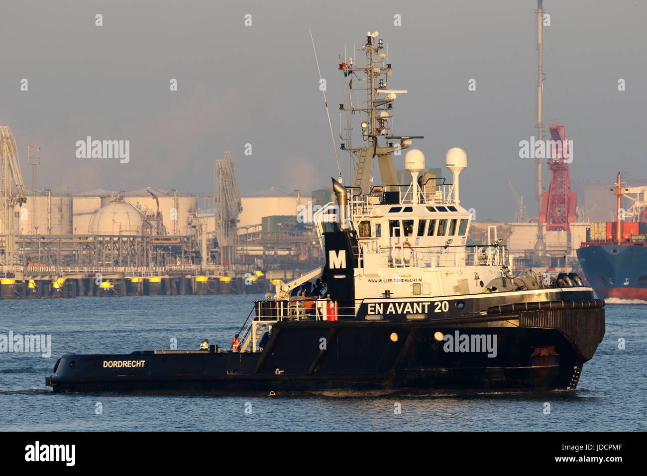 The tug boat EN Avant 20 turns in the port of Rotterdam. Stock Photo