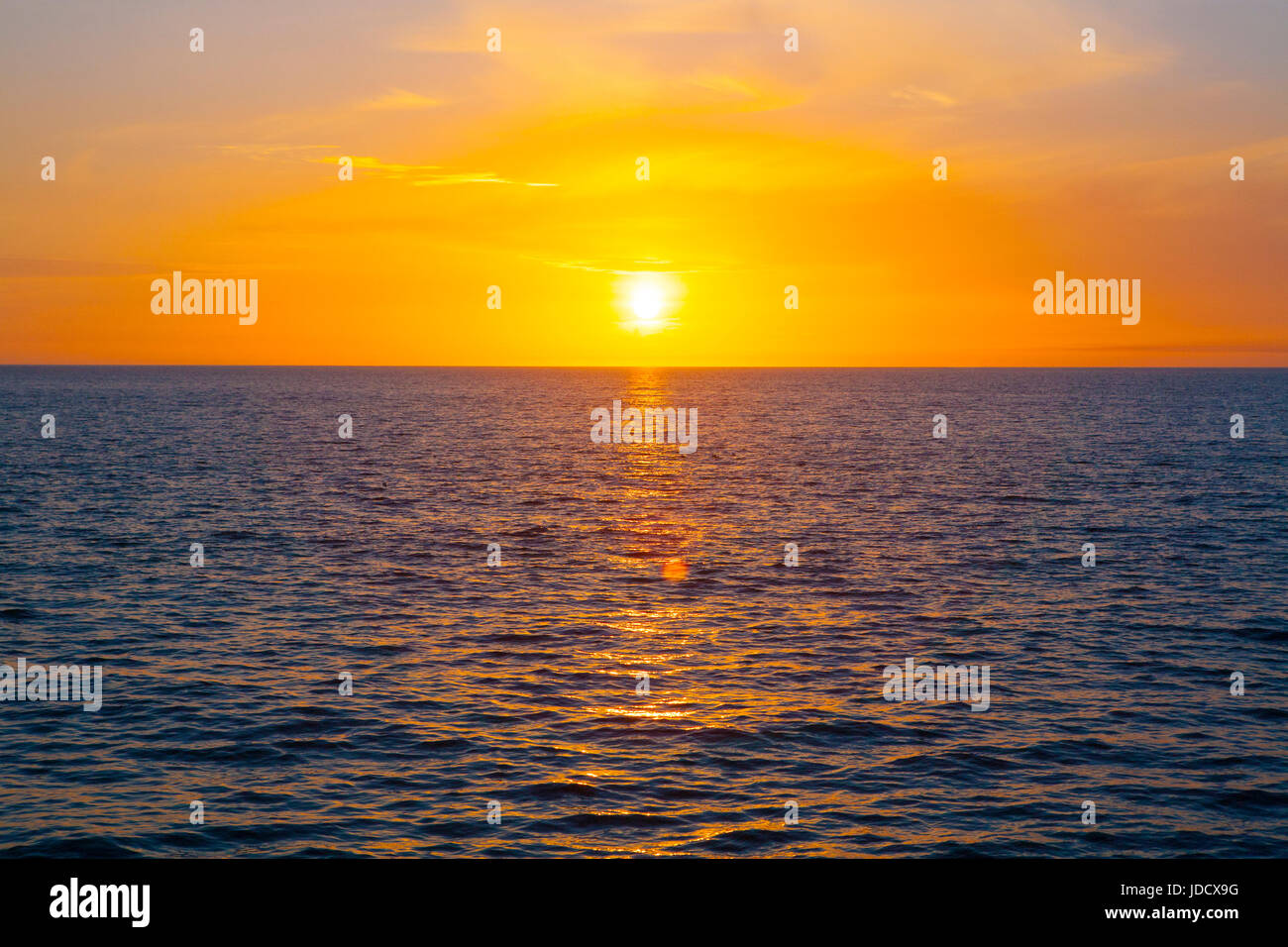 Golden sunset over water, Ocean, sea Stock Photo - Alamy