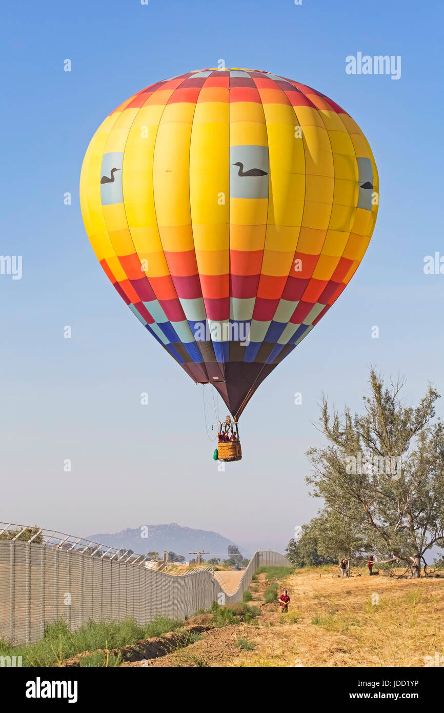 Balloons flying over California winery during Hot Air Balloon Festival