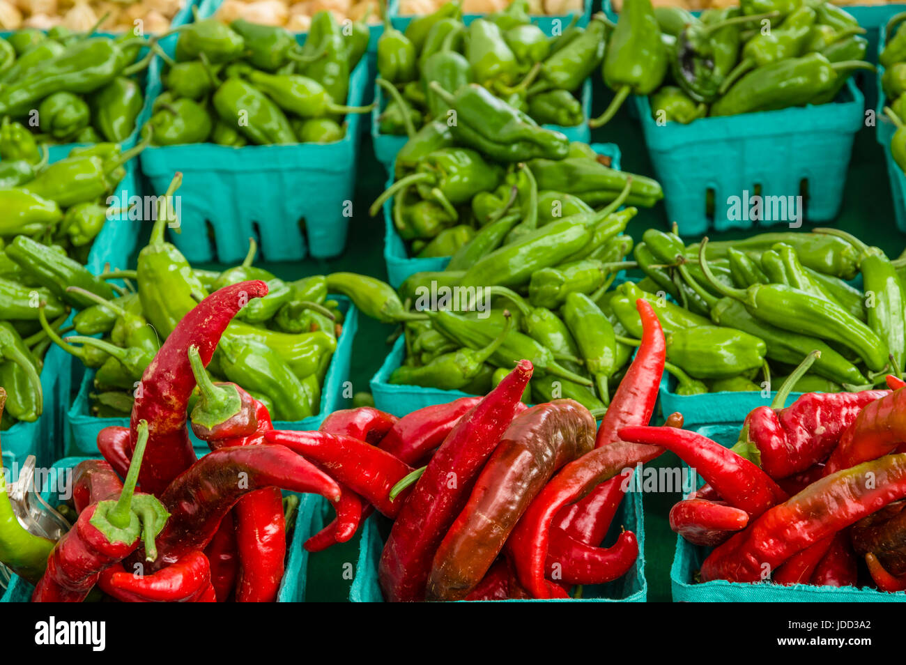 Boxes of red and green hot peppers at the farm market Stock Photo - Alamy