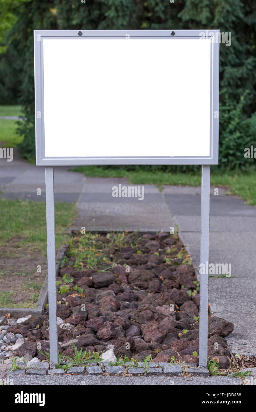 Blank ad space sign infront of trees in a park Stock Photo - Alamy